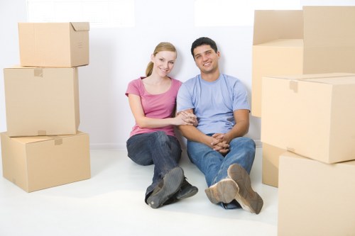 Boxes and furniture being transported by man and van service