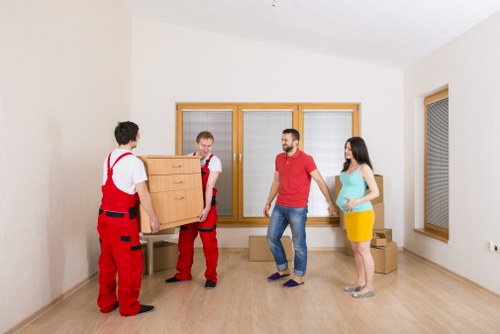 Packed furniture and boxes being loaded into a removals van in central London