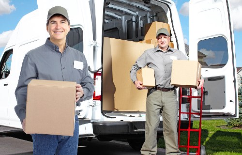 Professional movers navigating a central London building access point